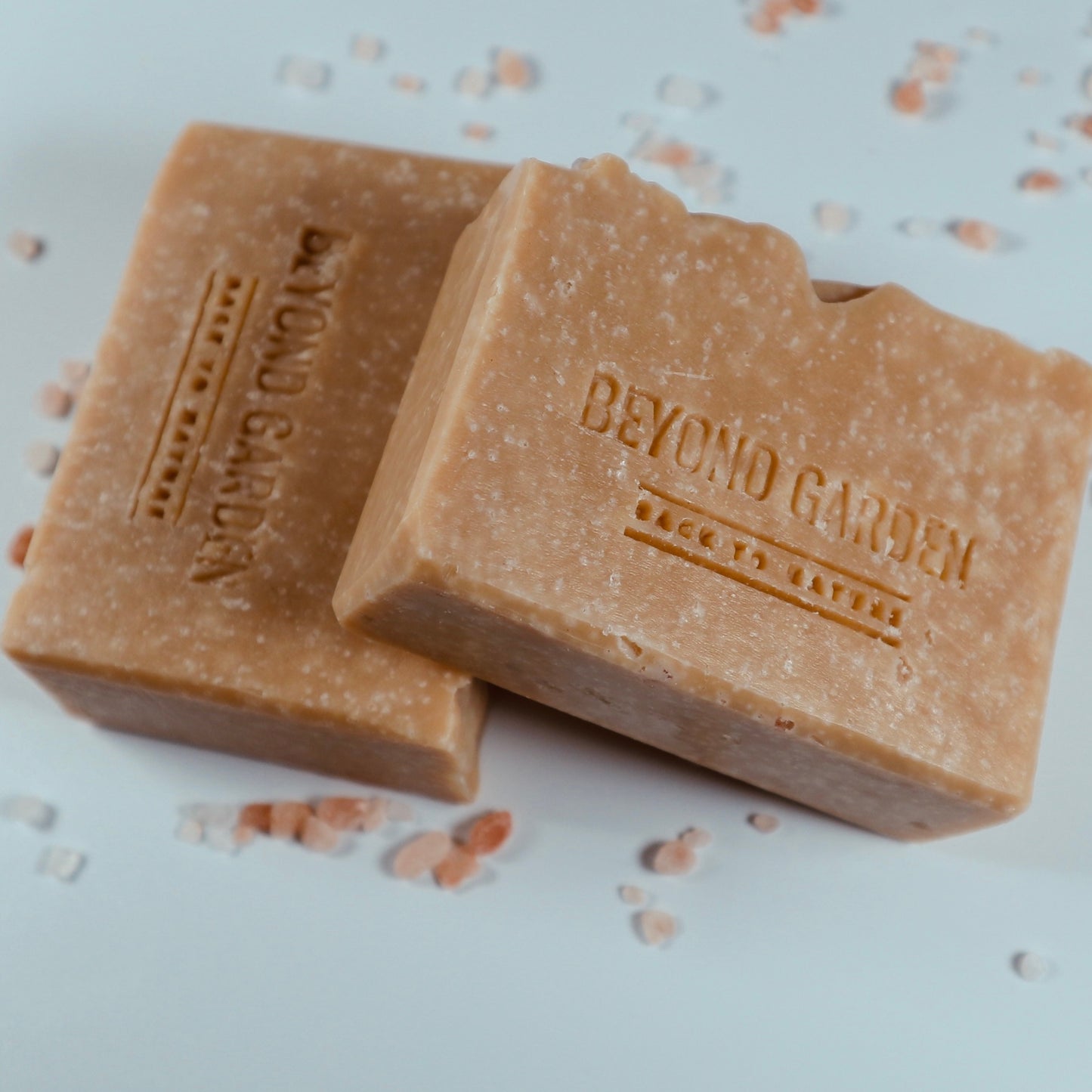 Two handmade salt bars displayed with Himalayan salt sprinkles, showing the textured front of the bars.