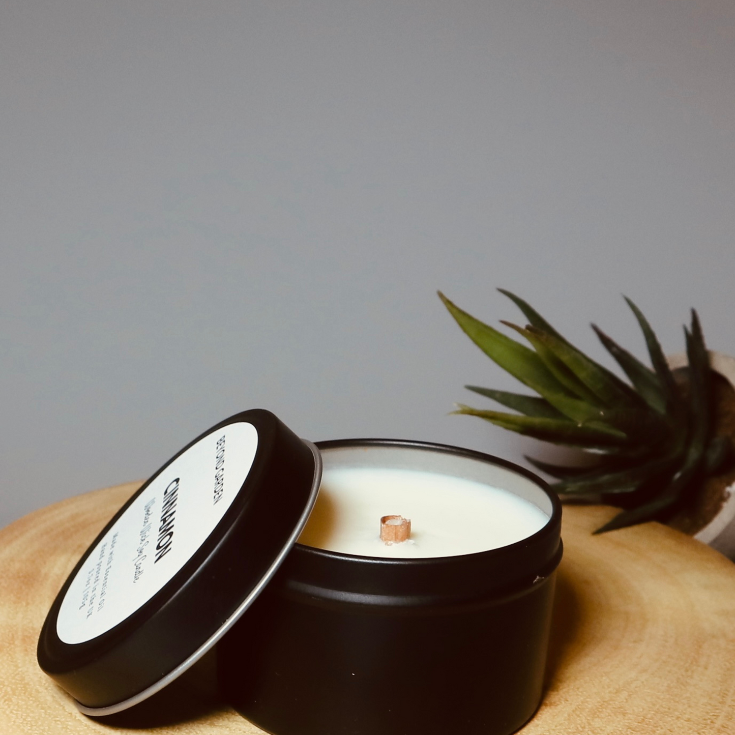 Cinnamon wooden wick candle in a lovely black travel tin
