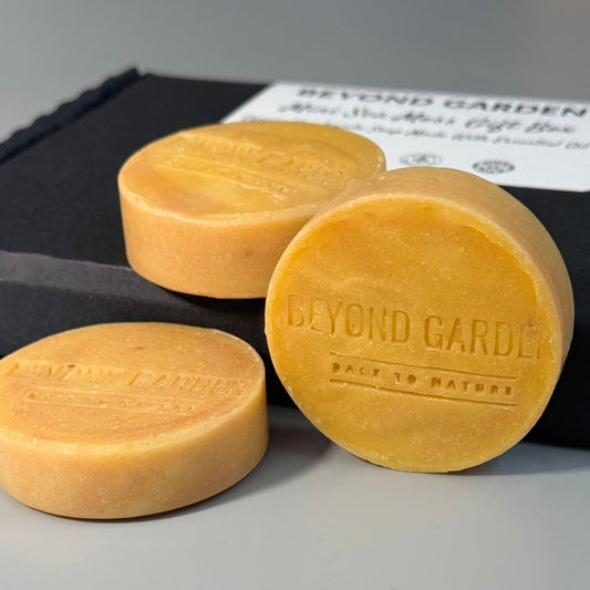 Round sea moss soap beautifully displayed on a sleek black box, highlighting sustainable practices and the nourishing benefits of natural skincare for a greener planet