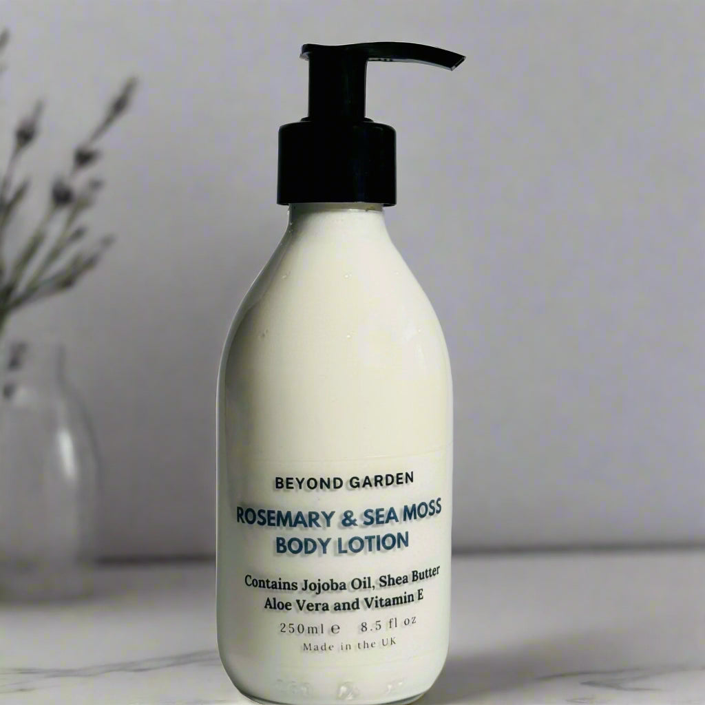 lotion bottle standing on a table showing the bottle front with  distance flower in the background